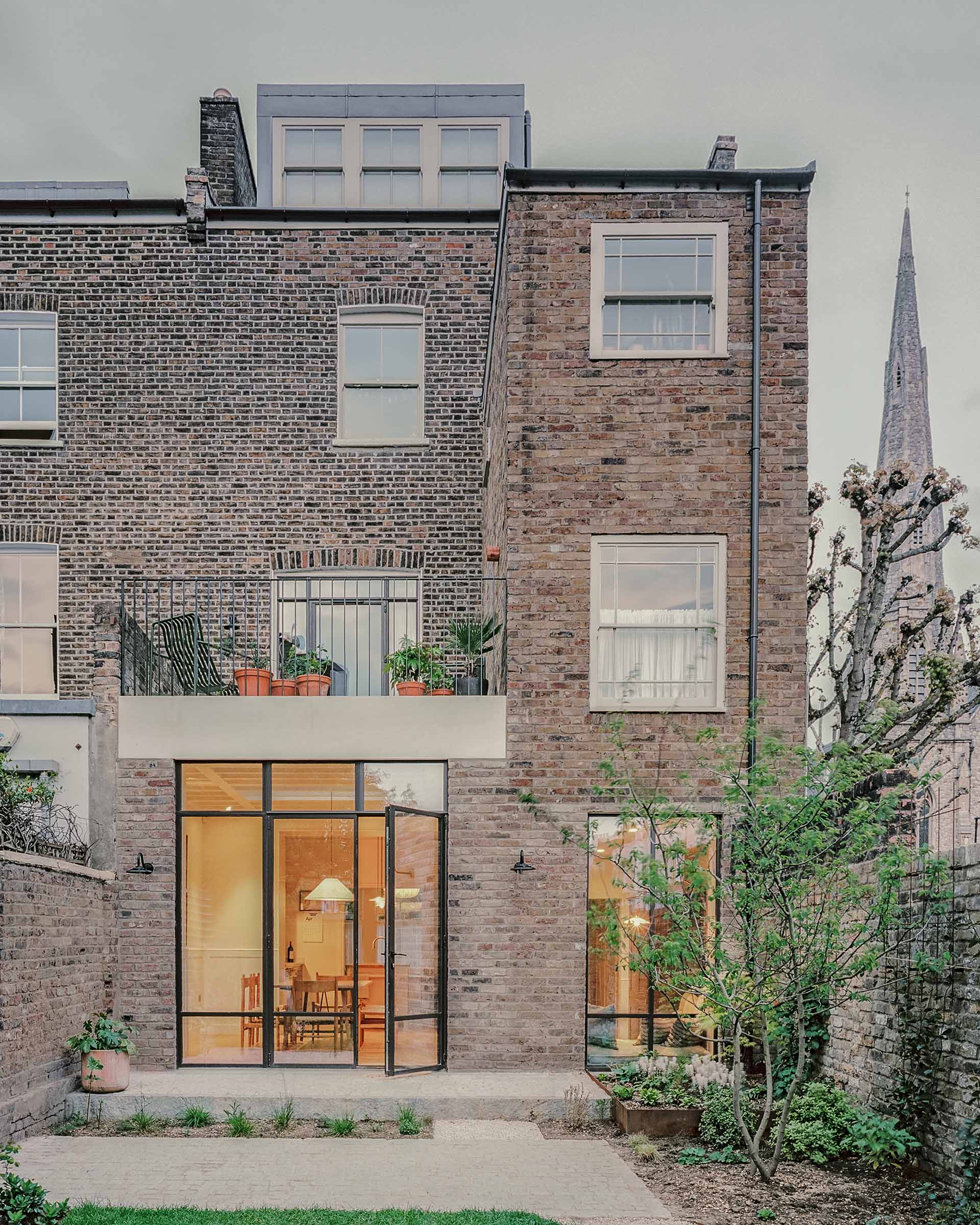 kentish town refurbishment and house extension crittal and brick with concrete lintels and loft dormer