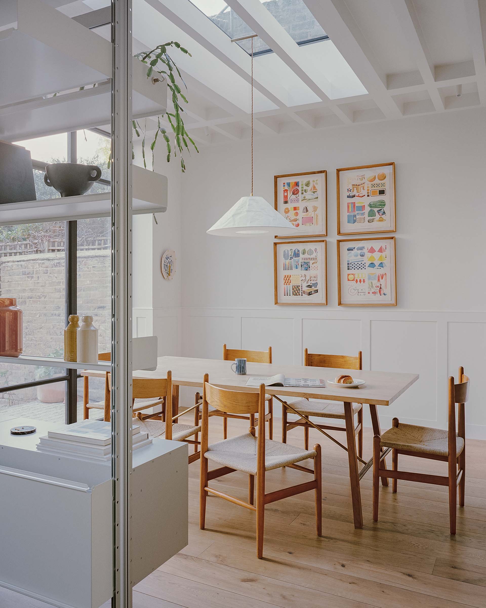 kitchen extension oak floor with mid century dining chairs and skylight
