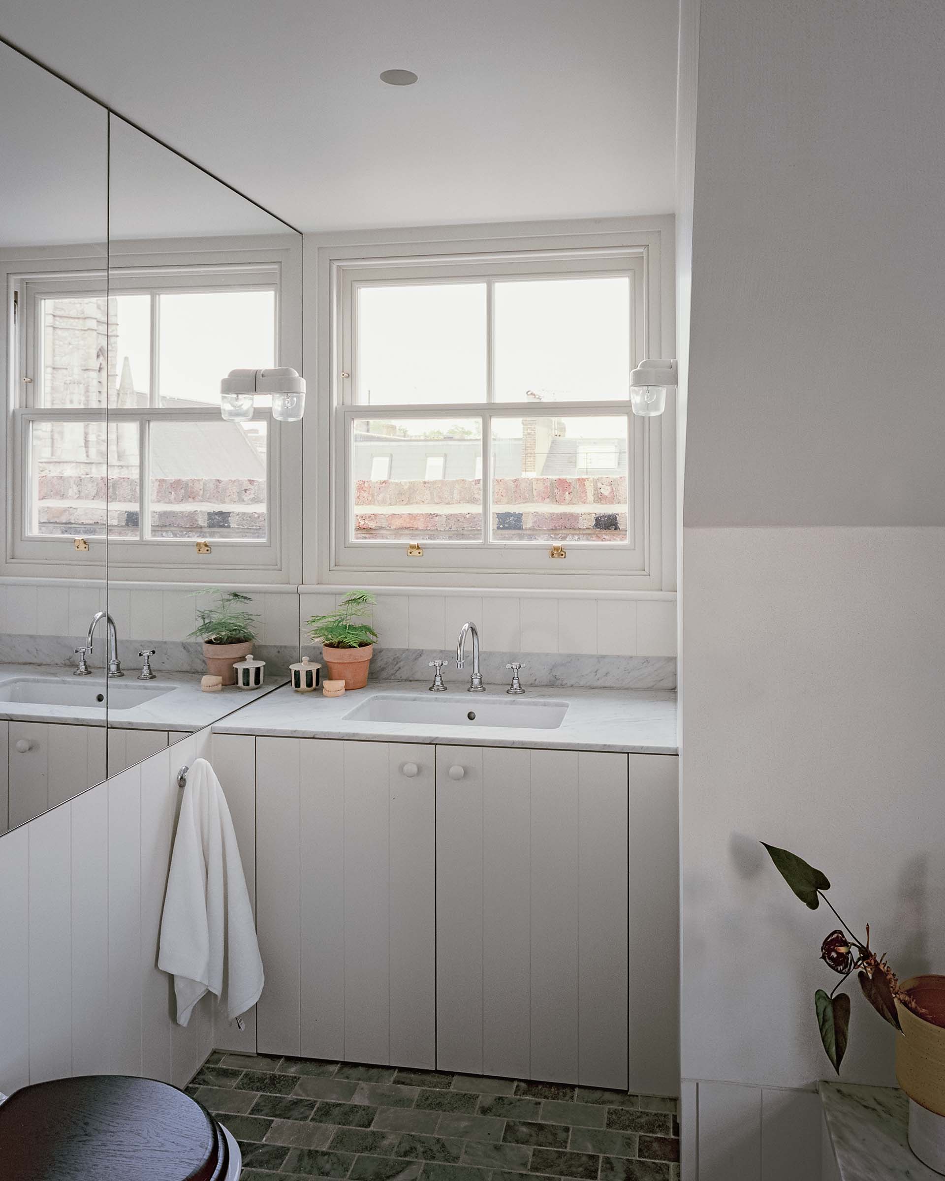 london house traditional panelled bathroom with white stone and mirror