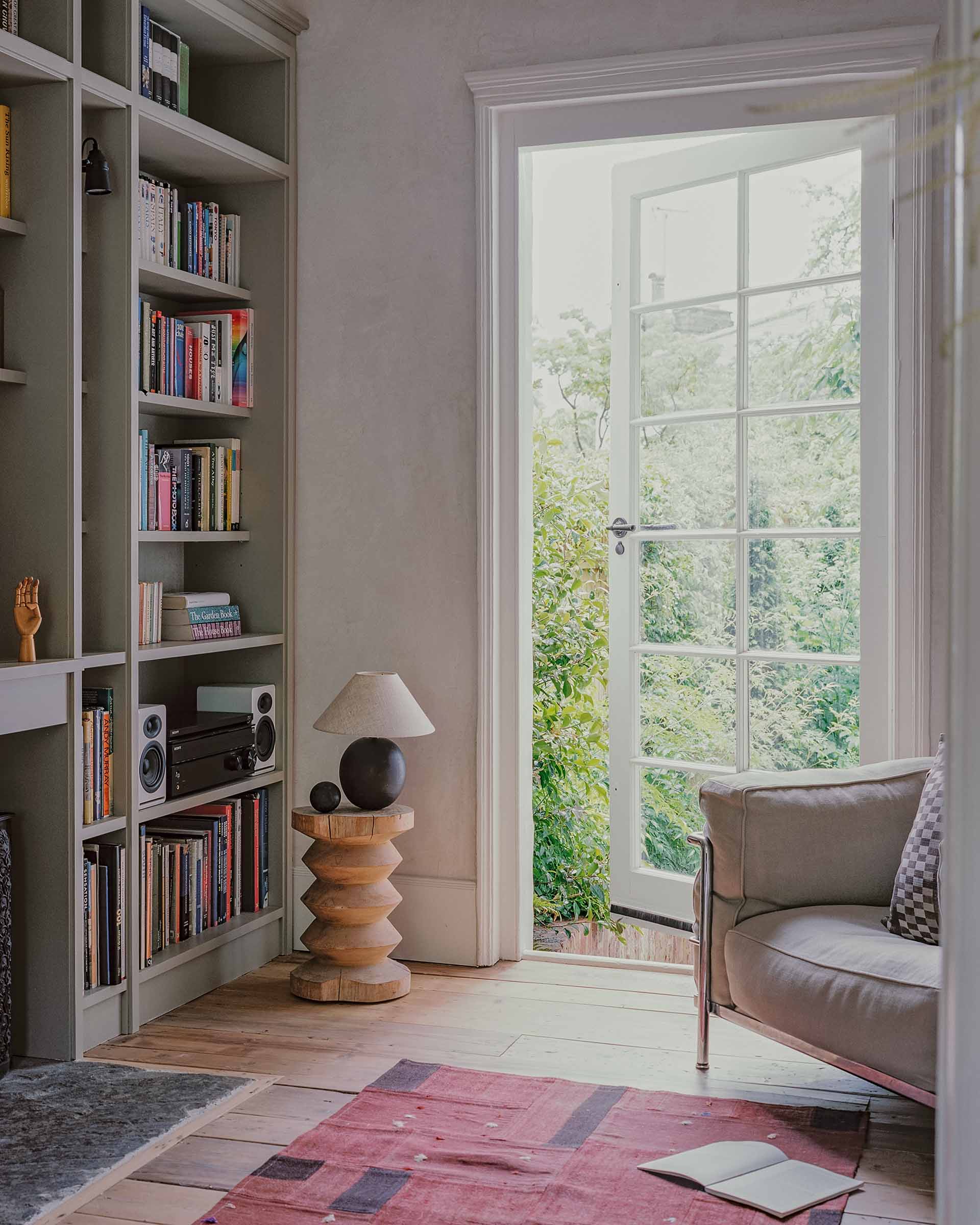 Georgian house library interior design with bespoke joinery bookshelves and a timber floor