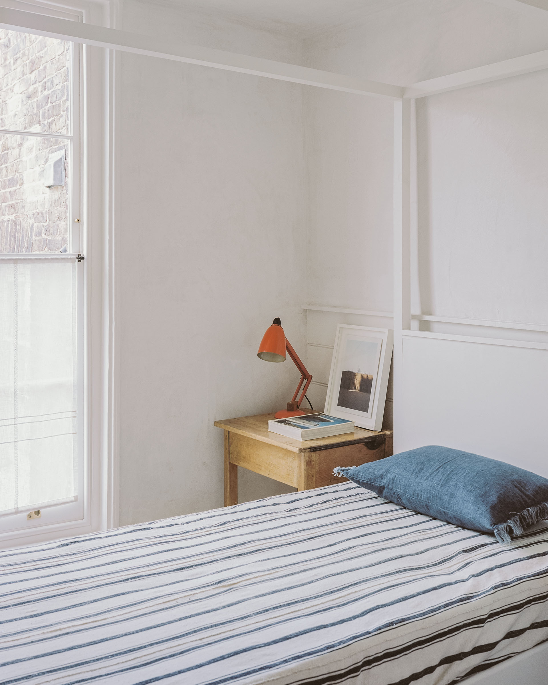 Hampstead architect bedroom design, with Georgian sash window, lime plaster and four poster bed