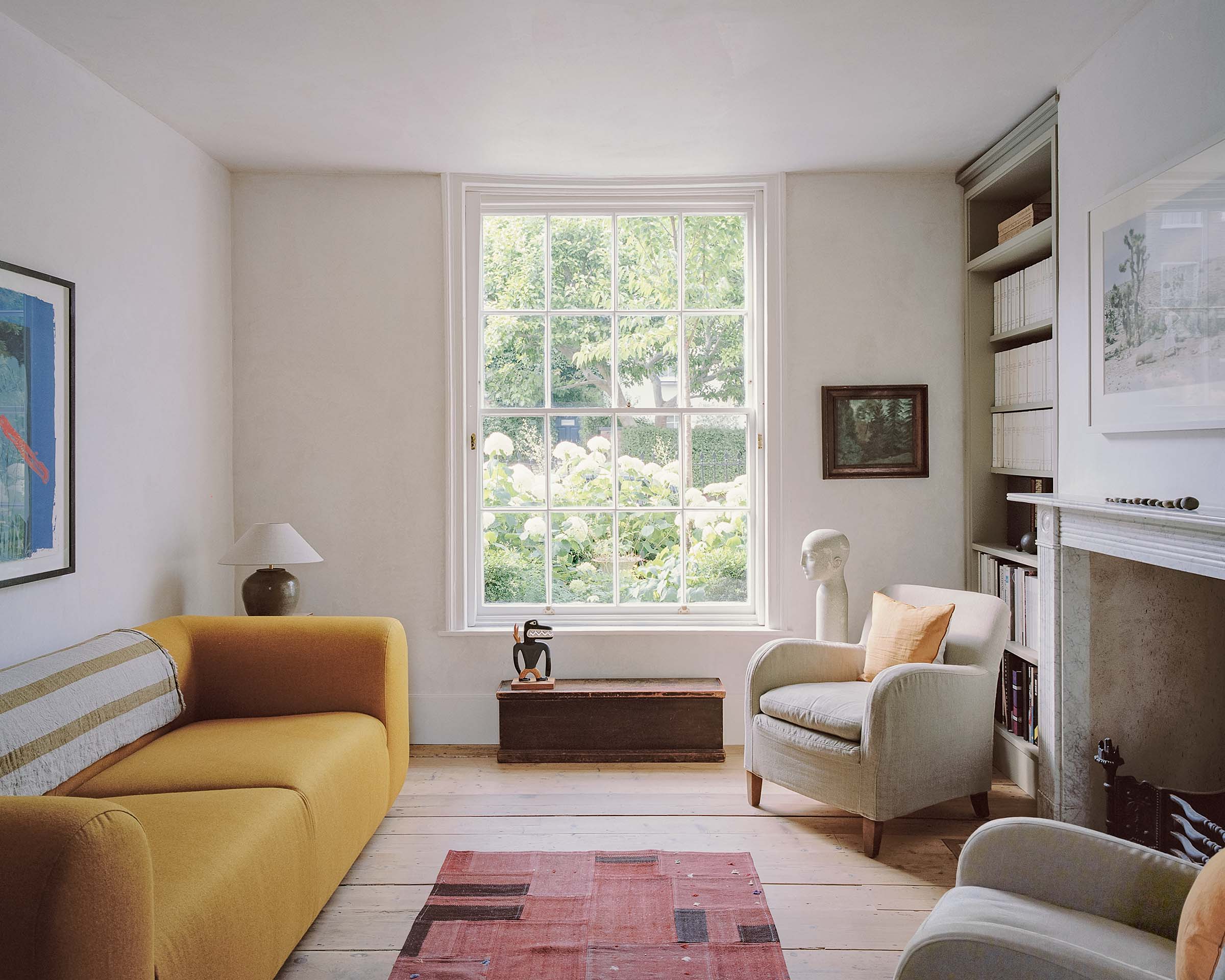 Hampstead georgian house interior design with sash window, colourful furniture and minimal aesthetic