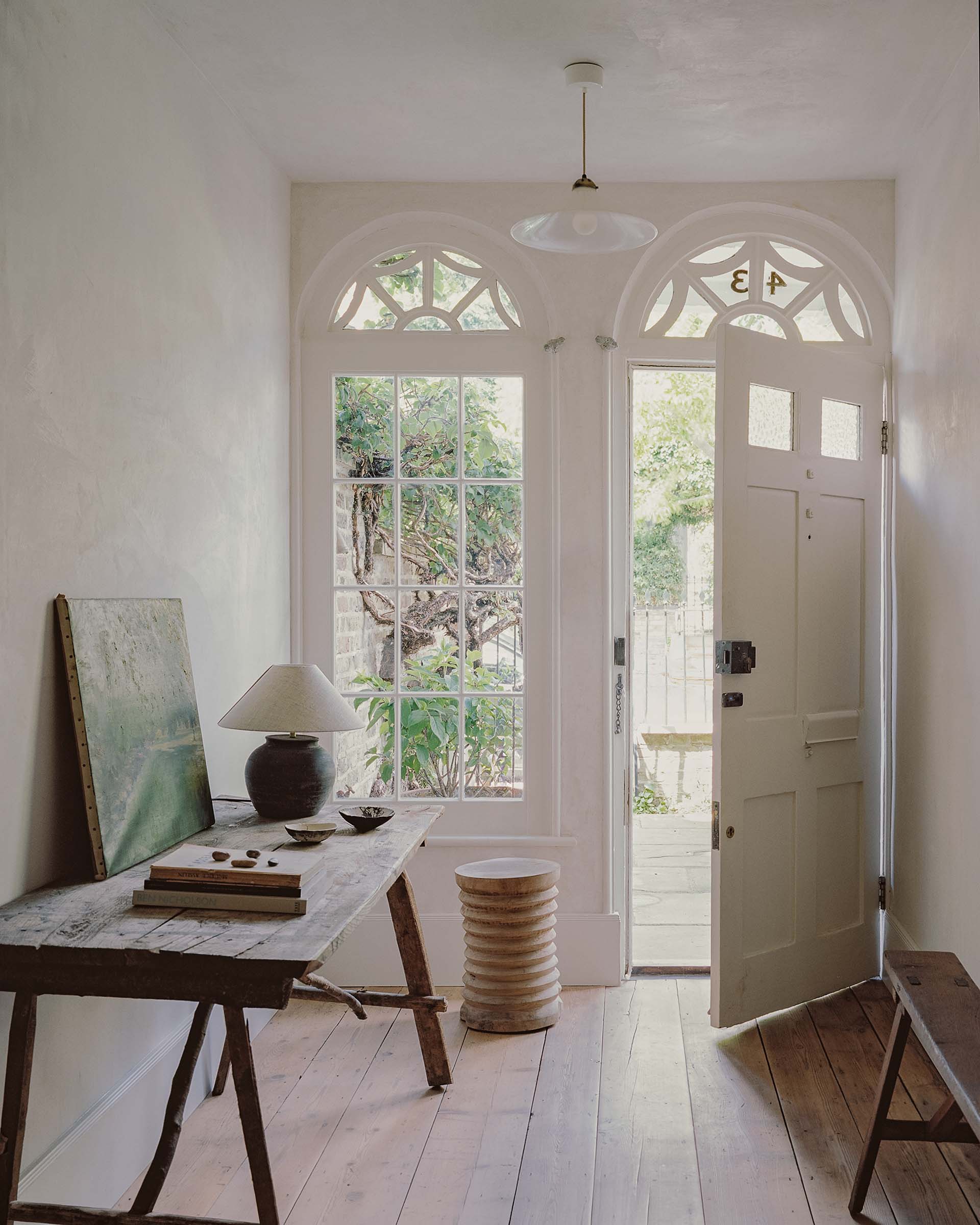 Hampstead georgian house traditional architect designed hallway with timber floor, wabi sabi furniture and georgian windows