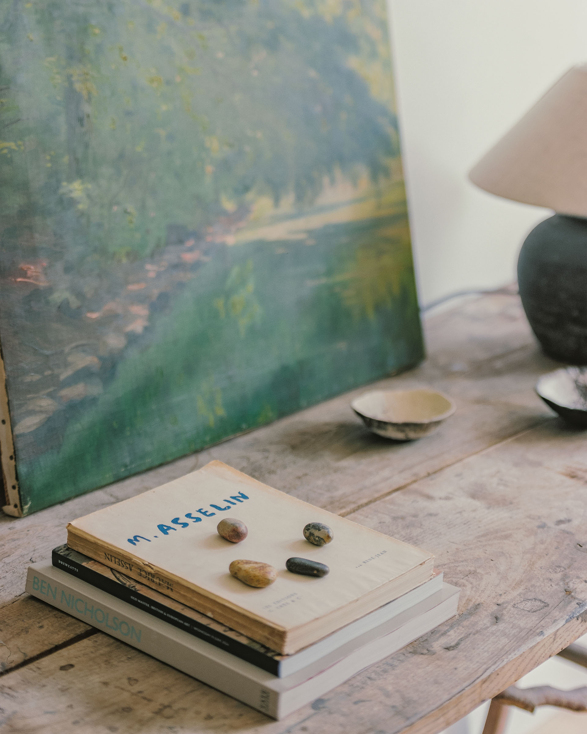 Hampstead house interior design with books, lamp, art and wabi sabi furniture