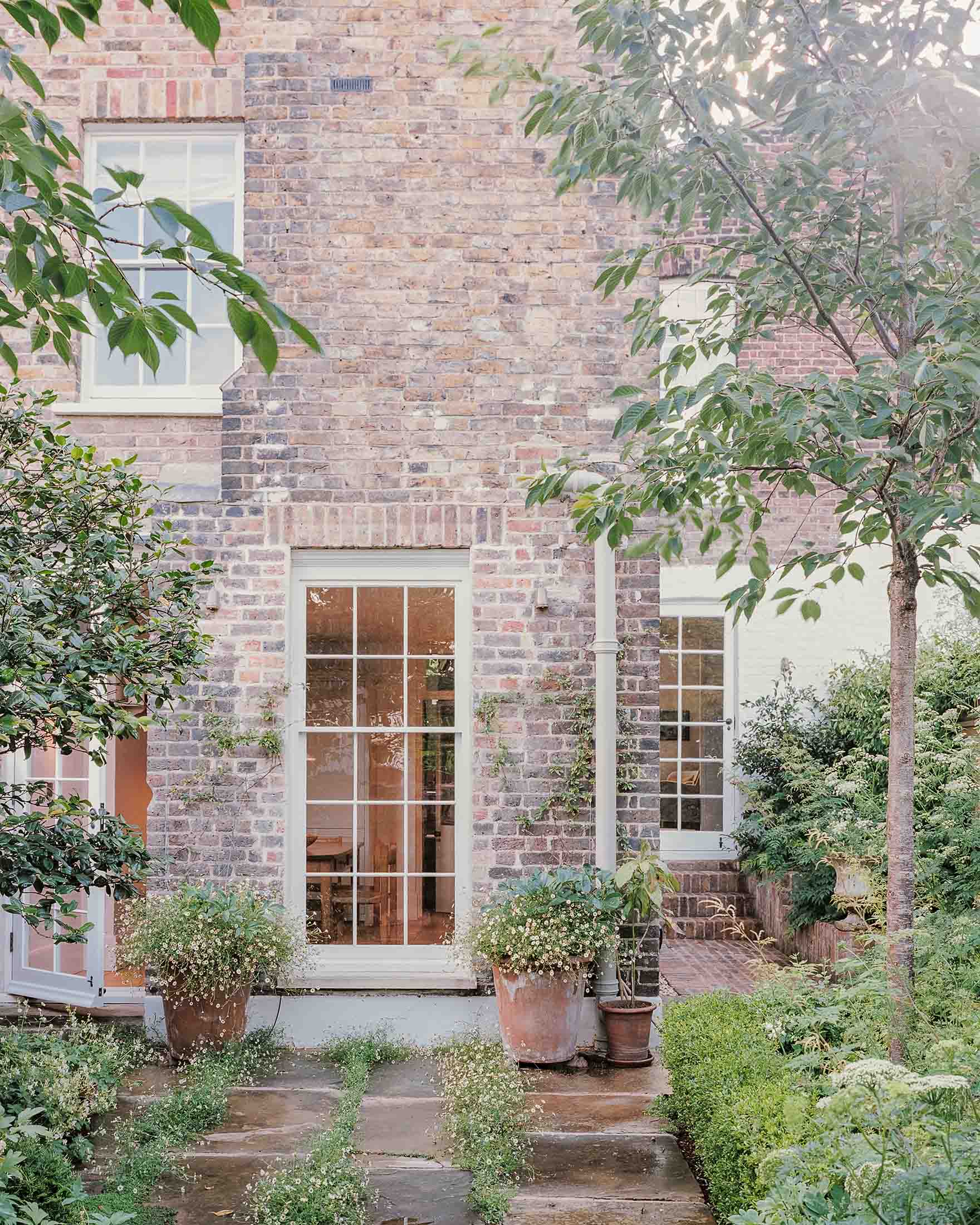 Hampstead house traditional cottage style brick rear extension from garden